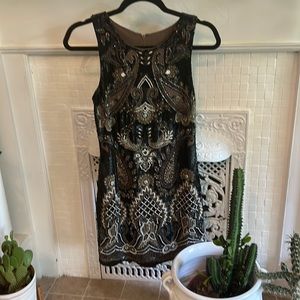 Needle and Thread. Stunning detail and stunning fit, all beaded